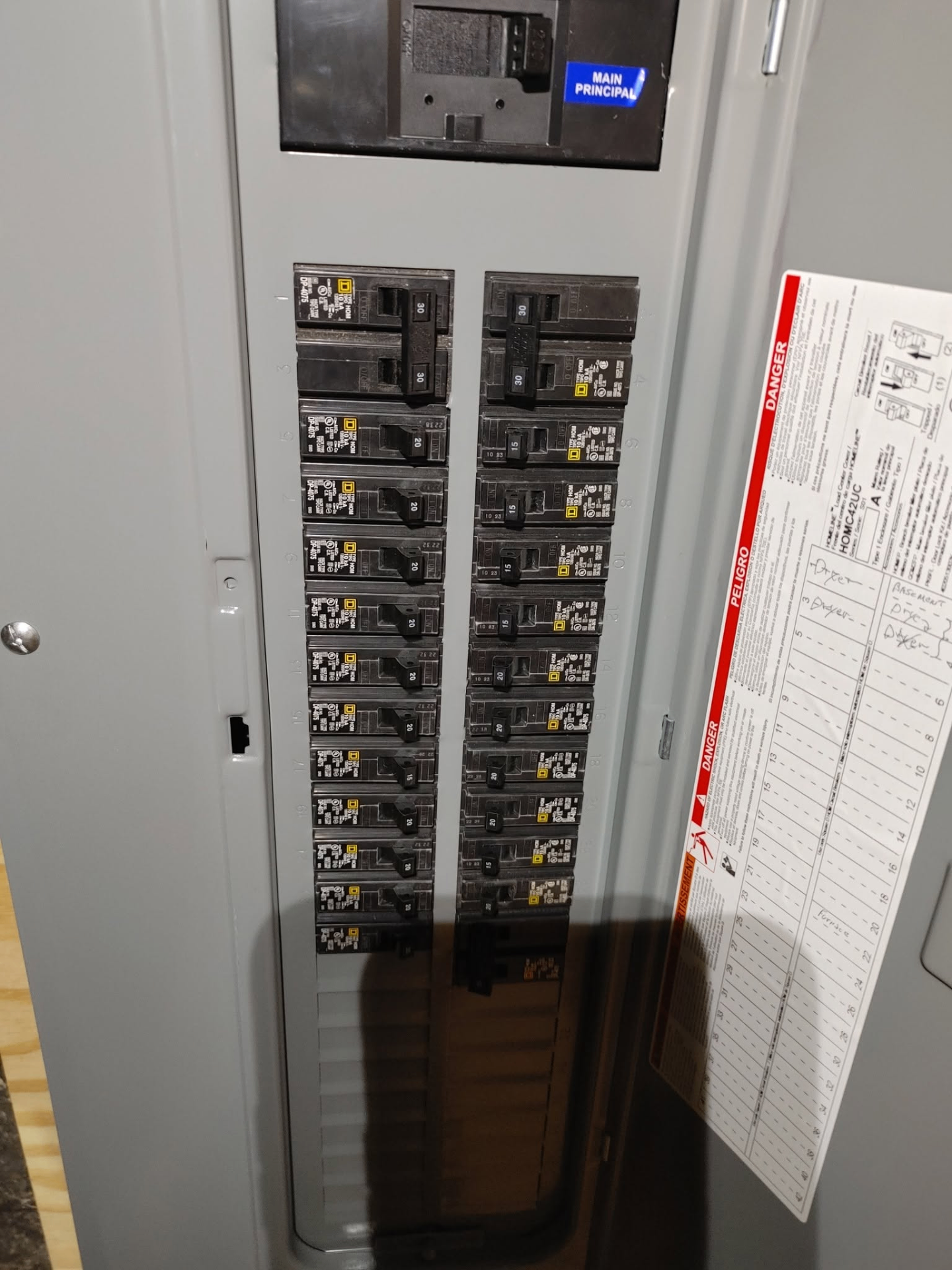 Open main electrical panel showing organized breakers with labeled directory