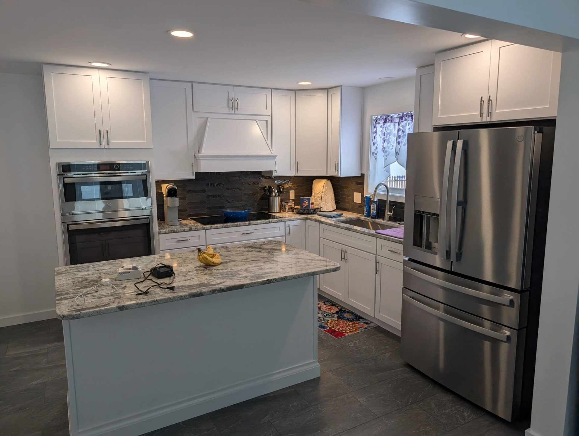 Modern kitchen with recessed lights, under-cabinet glow, and updated finishes